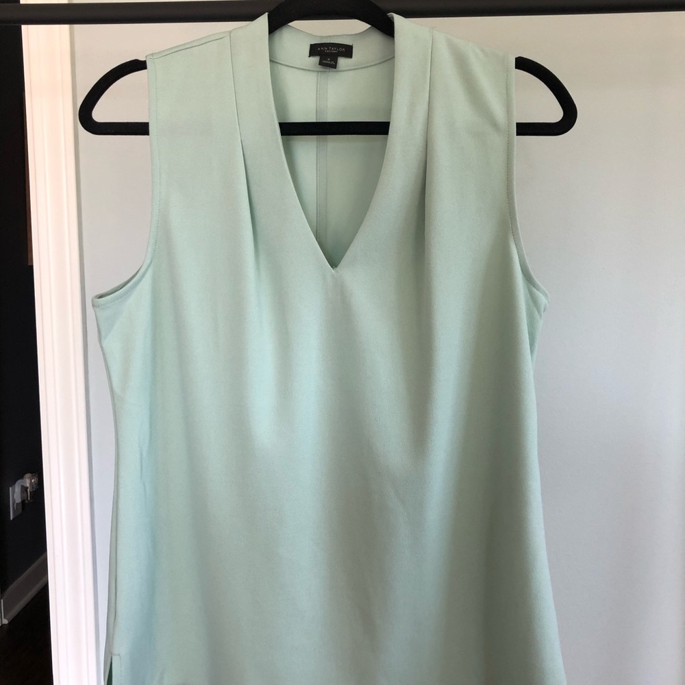 Mint green sleeveless blouse